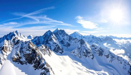 Obraz premium Majestic snowcovered mountain range under a bright blue sunny sky with scenic landscape.