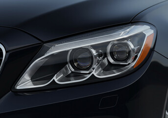  A detailed close-up of a luxury vehicle’s headlight, showcasing sleek design and high-end LED technology. The dark background and reflective surfaces emphasize the modern aesthetic.