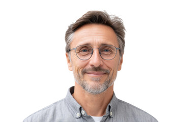 A mature man with glasses smiling warmly at the camera. showcasing a friendly demeanor. set against a neutral background that emphasizes his approachable personality and professionalism