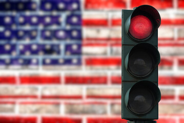 Flag of the United States of America and red traffic light as a symbol for the closed borders
