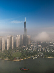 View of Landmark Building and Saigon River sunny in morning fog Vertical video.