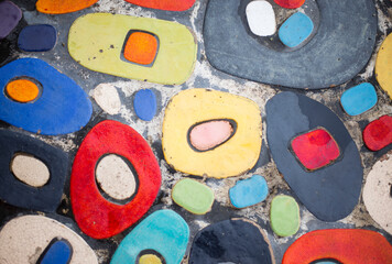 Colorful ceramic mosaic on the floor. Abstract background and texture for design.