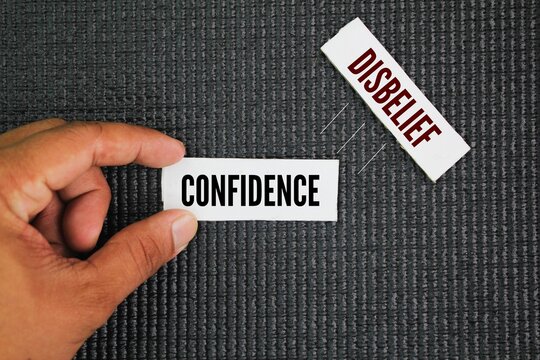 Two opposite words Confidence and Disbelief. confidence being a belief in one's own abilities and disbelief being a lack of belief or doubt.