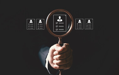 Concept of human resource recruitment visuals of magnifying glass highlighting ideal candidate icon, symbolizing process of headhunting, talent acquisition, employee selection, effective hiring.