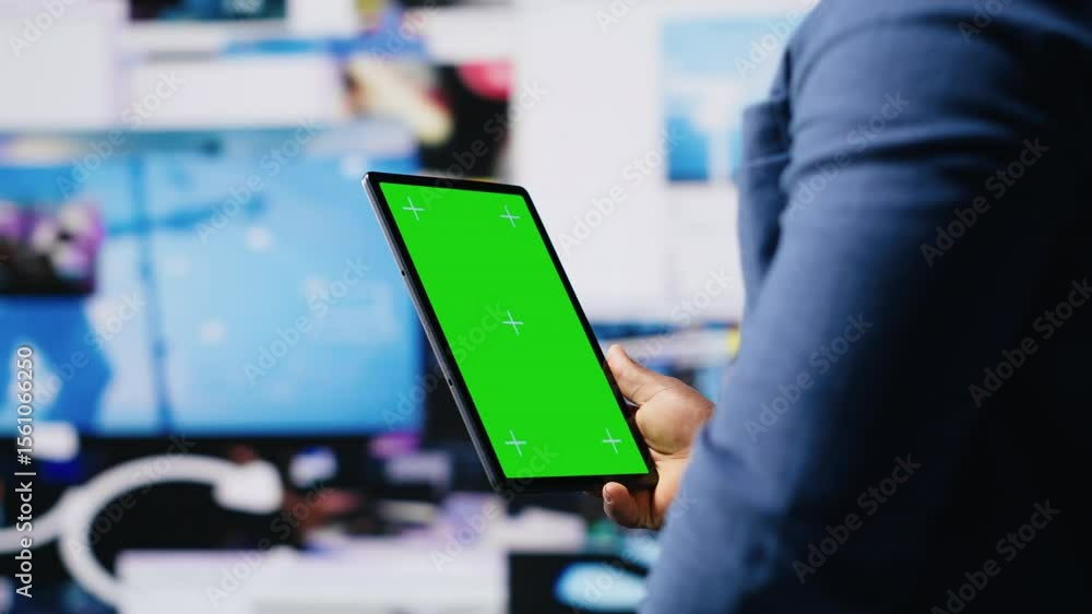 Poster african american tech enthusiast looking at chroma key screen next to digital interfaces and multime