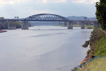 Bridges in the distance over a river.
