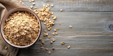 Oat flakes in a bowl at top view