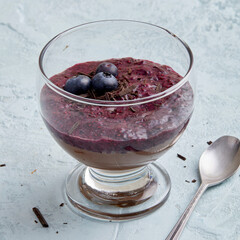 Lupin chocolate cream dessert with blueberry topping