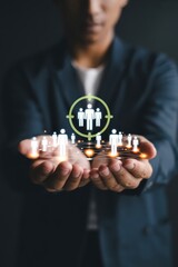 A network of people held in the hands.
