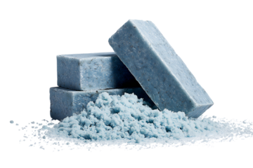 Blue soap bars and crumbs on dark background.