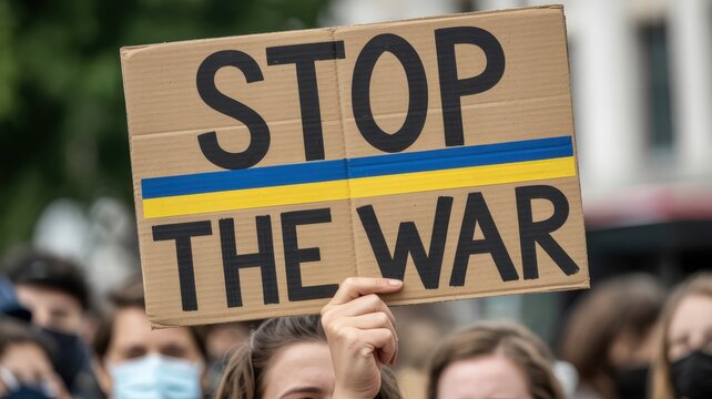 A protest sign reading "Stop the War".