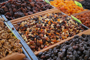 Vibrant dried fruits and nuts at a market stall