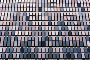 Abstract modern ventilated facade of aluminum tiles rectangles. Architectural pixelate, mosaic of...