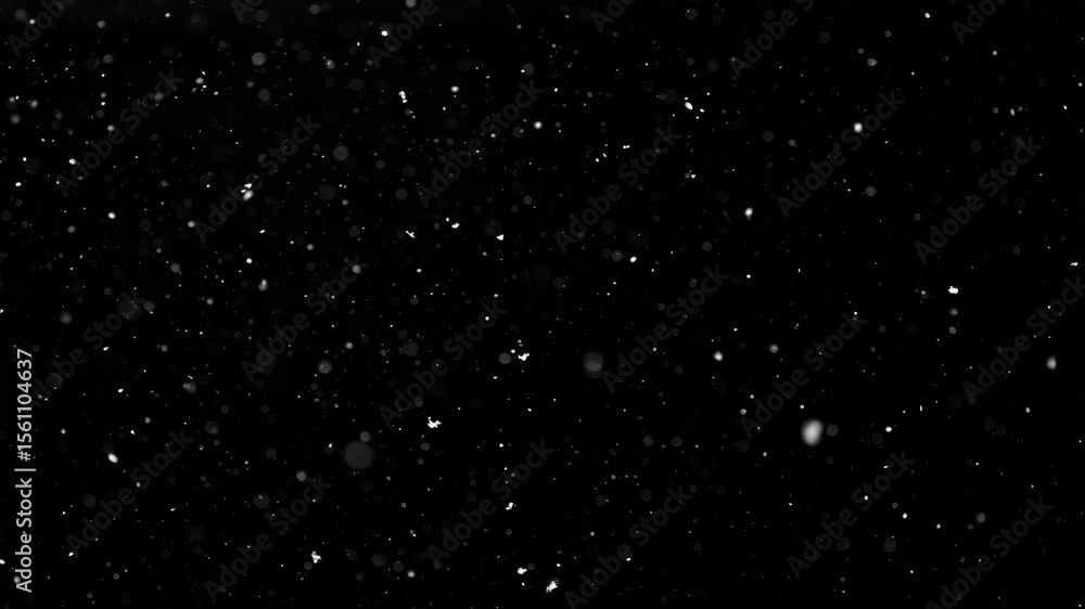 Poster falling white particles against black background creating a captivating visual effect