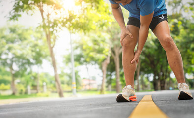 Runner Leaning Over with Leg Discomfort During Jog