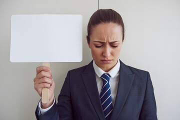 Businesswoman Holding Blank Sign, Expressing Sadness