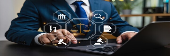 Businessperson interacting with digital legal icons on a laptop.