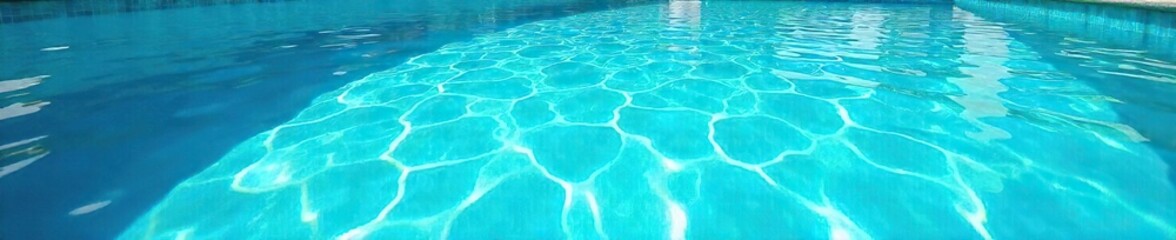 Sparkling Turquoise Pool Water Shimmers Under Summer Sun Perfect for Relaxation, Vacation, and Travel