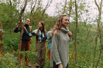 Active middle age woman enjoying outdoor fitness and wellbeing during a healthy forest hike with...