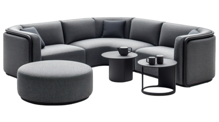 Modern, curved grey sofa with side tables and an ottoman
