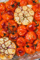 Cherry tomatoes baked with thyme and garlic clove