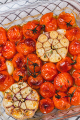 Cherry tomatoes baked with thyme and garlic clove
