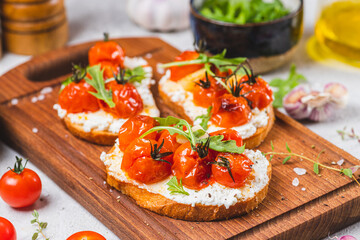Bruschetta with ricotta and baked tomatoes