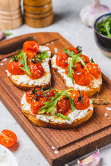 Bruschetta with ricotta and baked tomatoes