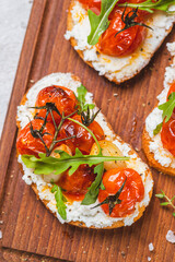 Bruschetta with ricotta and baked tomatoes