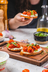 Bruschetta with ricotta and baked tomatoes