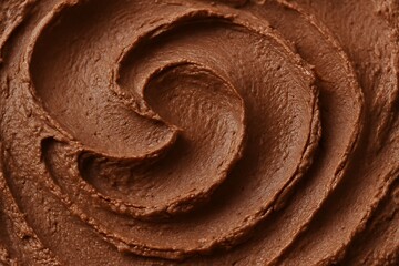 Close up texture of swirled chocolate frosting