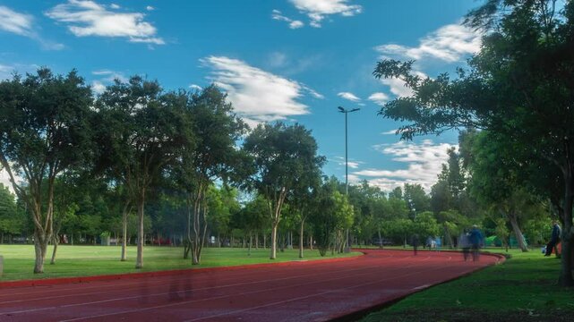 Time-lapse of people running on the athletics track in La Carolina Park during the morning in Quito - Ecuador