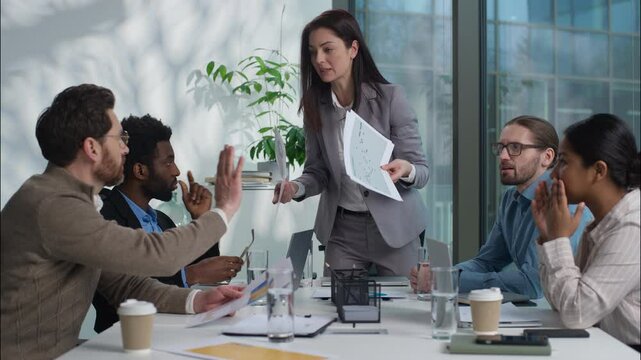 Multinational business team office businesswomen African businessmen argue angry leader Caucasian woman director boss shouting scream scold workers employers documents fail paperwork problem conflict
