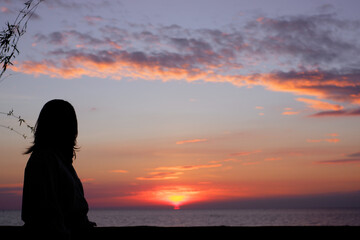 Fototapeta premium sunset in the sea. Beautiful colorful sky and cloud in twilight time background. Orange fluffy clouds and sun sunlight reflection in the blue