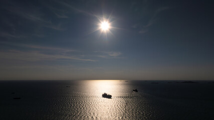 silhouette of shipping logistic cargo container ship sailing in sea to import export goods and...