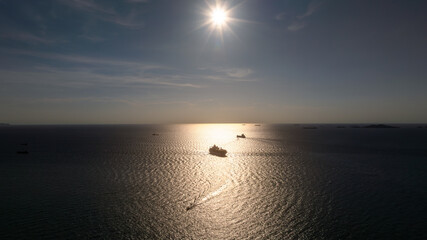 silhouette of shipping logistic cargo container ship sailing in sea to import export goods and...