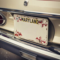 Close-up of a Maryland license plate on a vintage car, showing MARYLAND and a playful "Text Space" below, with a classic and nostalgic feel