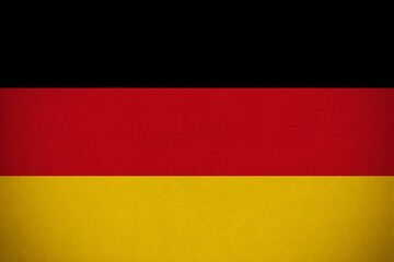 German flag is being displayed in flat design with fabric texture filling entire frame, copy space