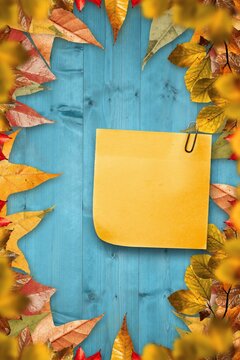 Fototapeta Autumn leaves with yellow note
