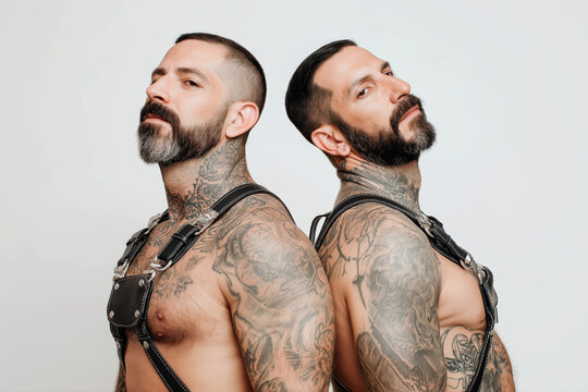 couple of gay adult men in leather harness on white background - Powered by Adobe