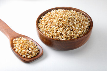 Sprouts or Matki in a wooden spoon and basket isolated on white background 