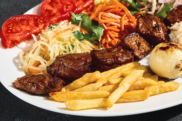 Trout shashlik platter bright overhead, grilled vegetables, rice, fries, Turkish bistro style