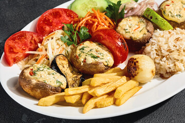 Grilled cheese-stuffed mushrooms, rustic bright overhead composition with rice, fries, and roasted...