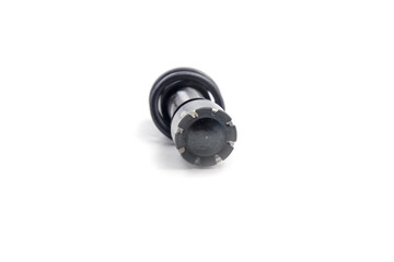 a metallic, cylindrical component, mechanical shaft or cam, with serrated or geared ends. A black,...