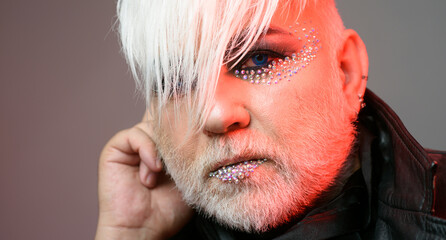 Transgender man with makeup. Bearded mature trans with eyeshadow. Transgender identity. Gender...