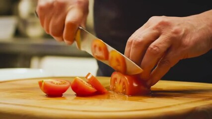 chef slicing a tomato in the resturant - Powered by Adobe