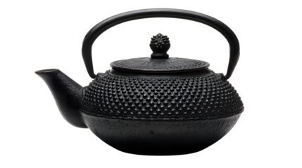 Photo of a black cast iron teapot with a textured surface and a small knob on the lid is isolated on transparent background