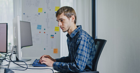 Young adult male freelance developer typing write prompt AI bot app program nomad terminal with...