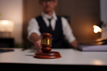 Lawyers are sitting in a meeting, searching for legal documents at the office.	