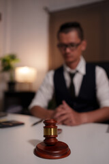 Lawyers are sitting in a meeting, searching for legal documents at the office.	